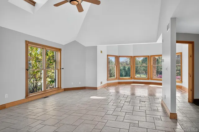 a view of an empty room with glass door