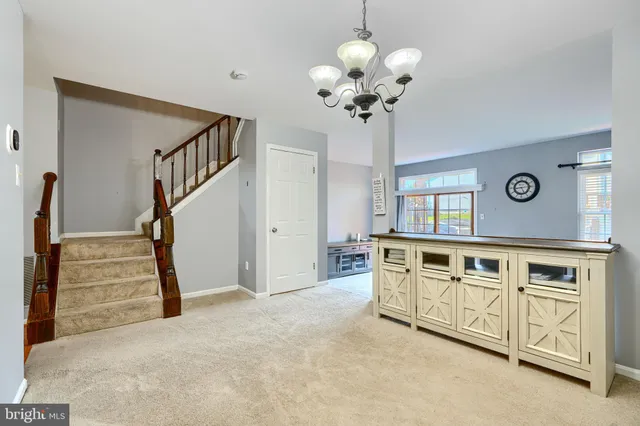 a view of an entryway with chandelier