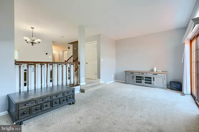 a balcony with furniture and wooden floor