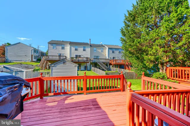 a view of a house with wooden deck