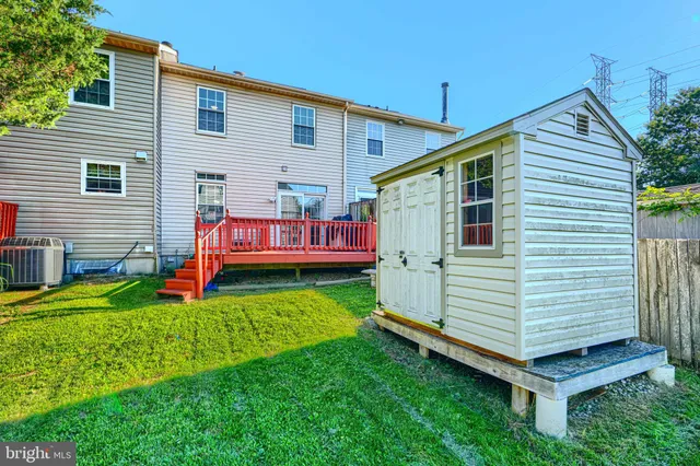 a backyard of a house with a garden and deck