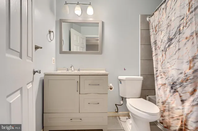 a bathroom with a shower and a shower