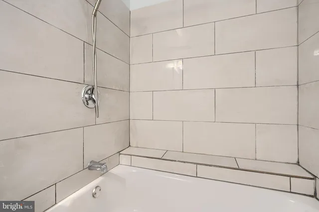 a view of bathroom with a sink a mirror and toilet