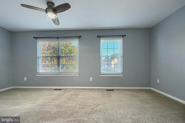 a bedroom with furniture and windows
