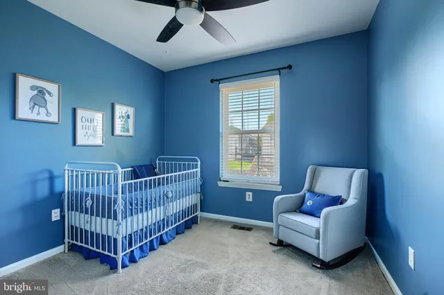 a bedroom with bed and window