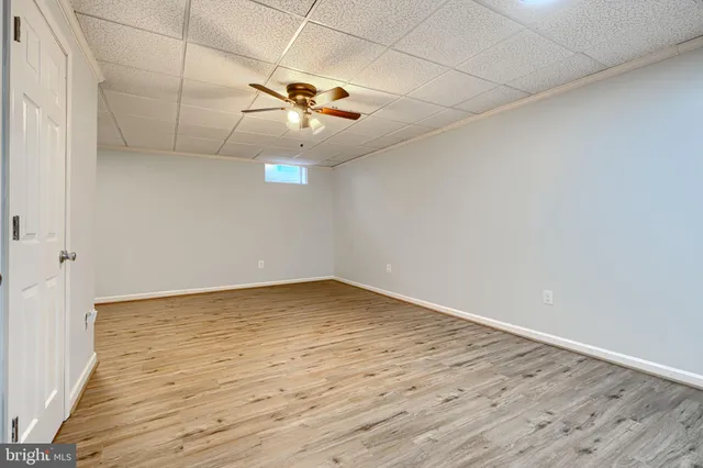 a reading room with furniture and wooden floor