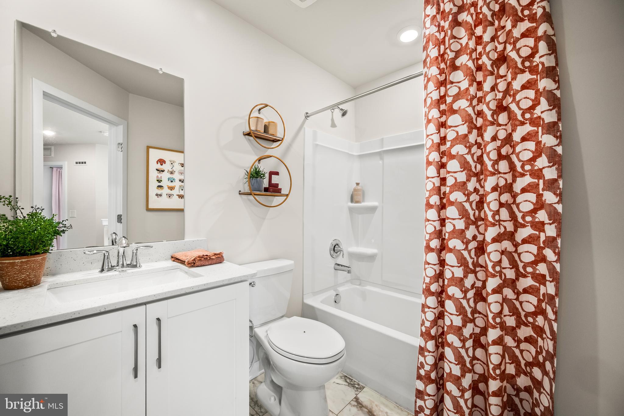 370 Mingo Way Townsend, DE 19734 - Photo 11 of 16 a bathroom with a sink toilet and shower