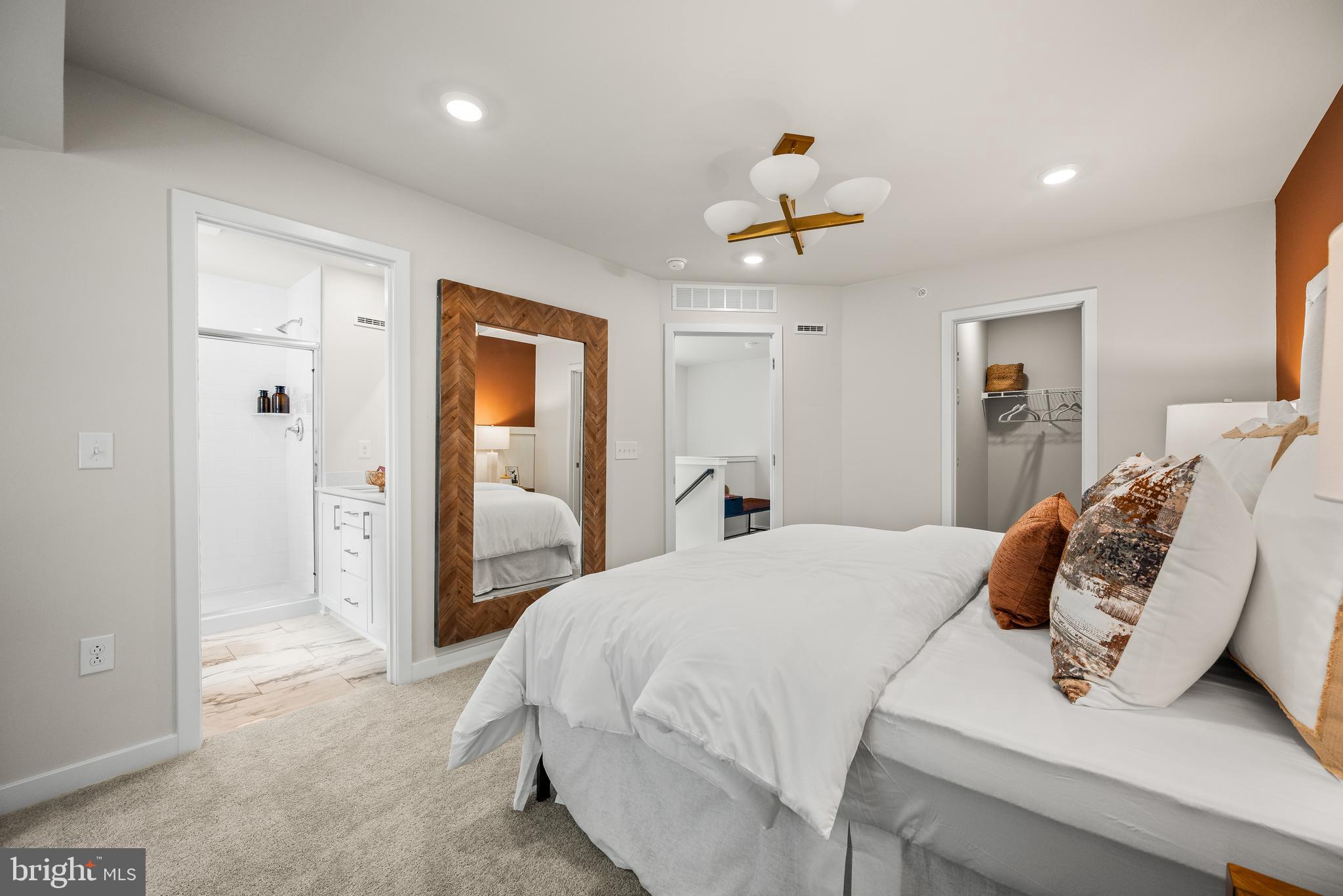 370 Mingo Way Townsend, DE 19734 - Photo 12 of 16 a bedroom with a bed and a chandelier