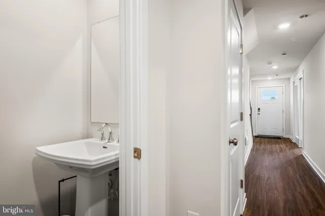 a bathroom with a sink and mirror