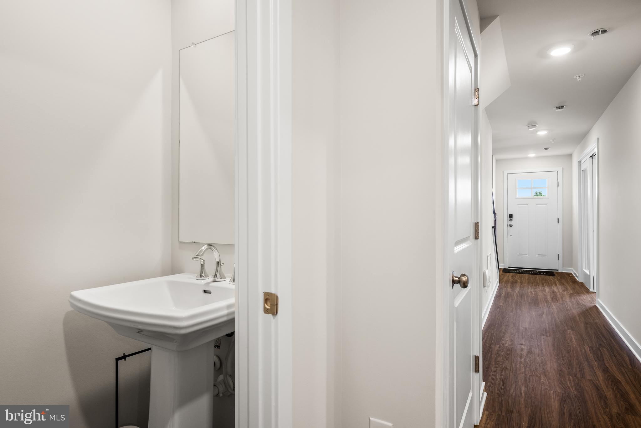 370 Mingo Way Townsend, DE 19734 - Photo 15 of 16 a bathroom with a sink and mirror