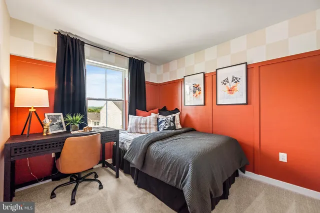 a bedroom with a bed lamps and window