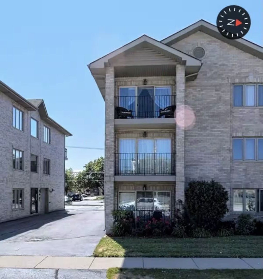 10620 Central Avenue, Unit 2A Chicago Ridge, IL 60415 - Photo 15 of 16 a front view of a house with garden