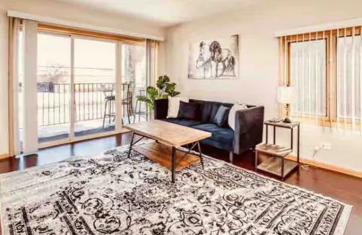 10620 Central Avenue, Unit 2A Chicago Ridge, IL 60415 - Photo 4 of 16 a living room with a couch and a table