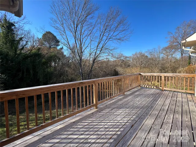 a view of balcony with wooden floor