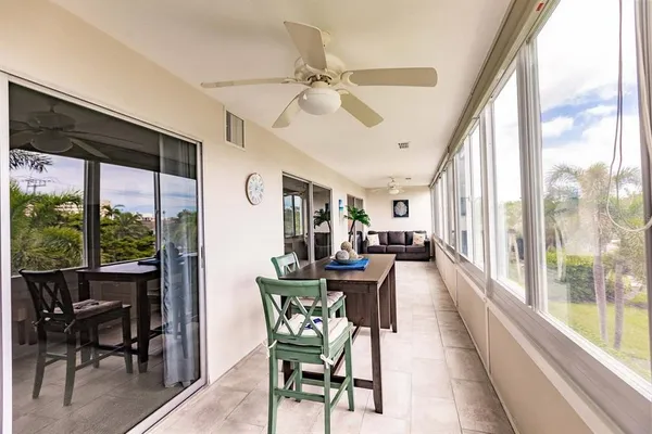 a view of a dining room with furniture window and outside view