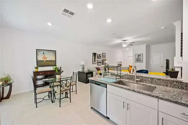 a kitchen with sink and cabinets
