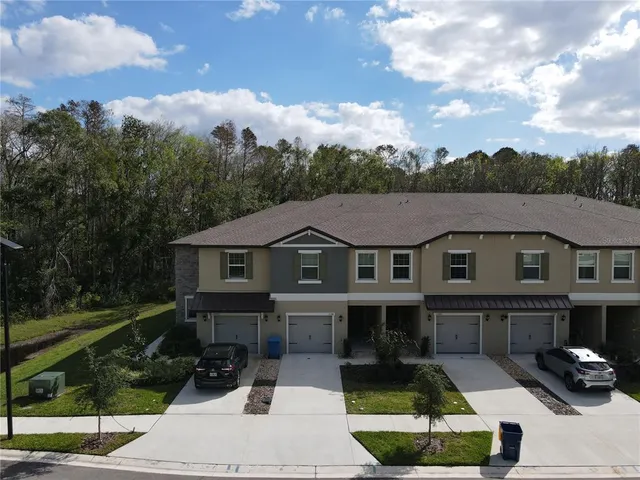 a view of house with yard outdoor seating and barbeque oven
