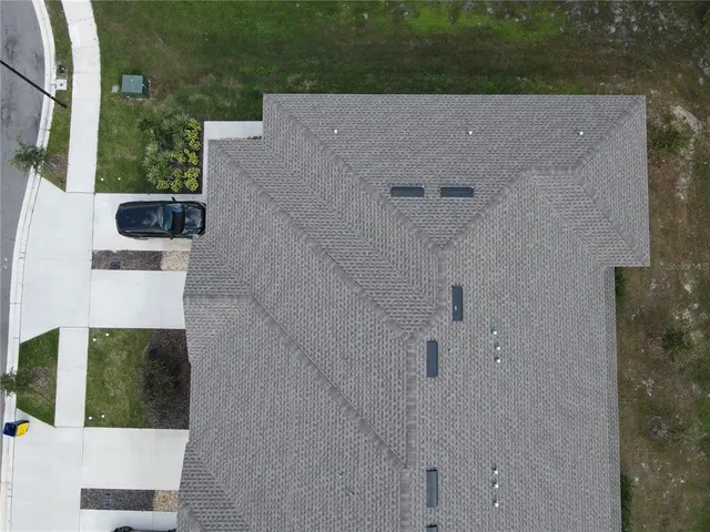 an aerial view of residential house with outdoor space