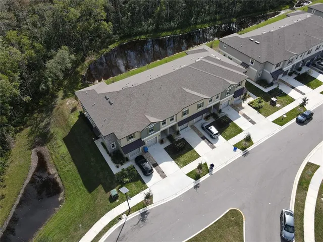 an aerial view of house with yard