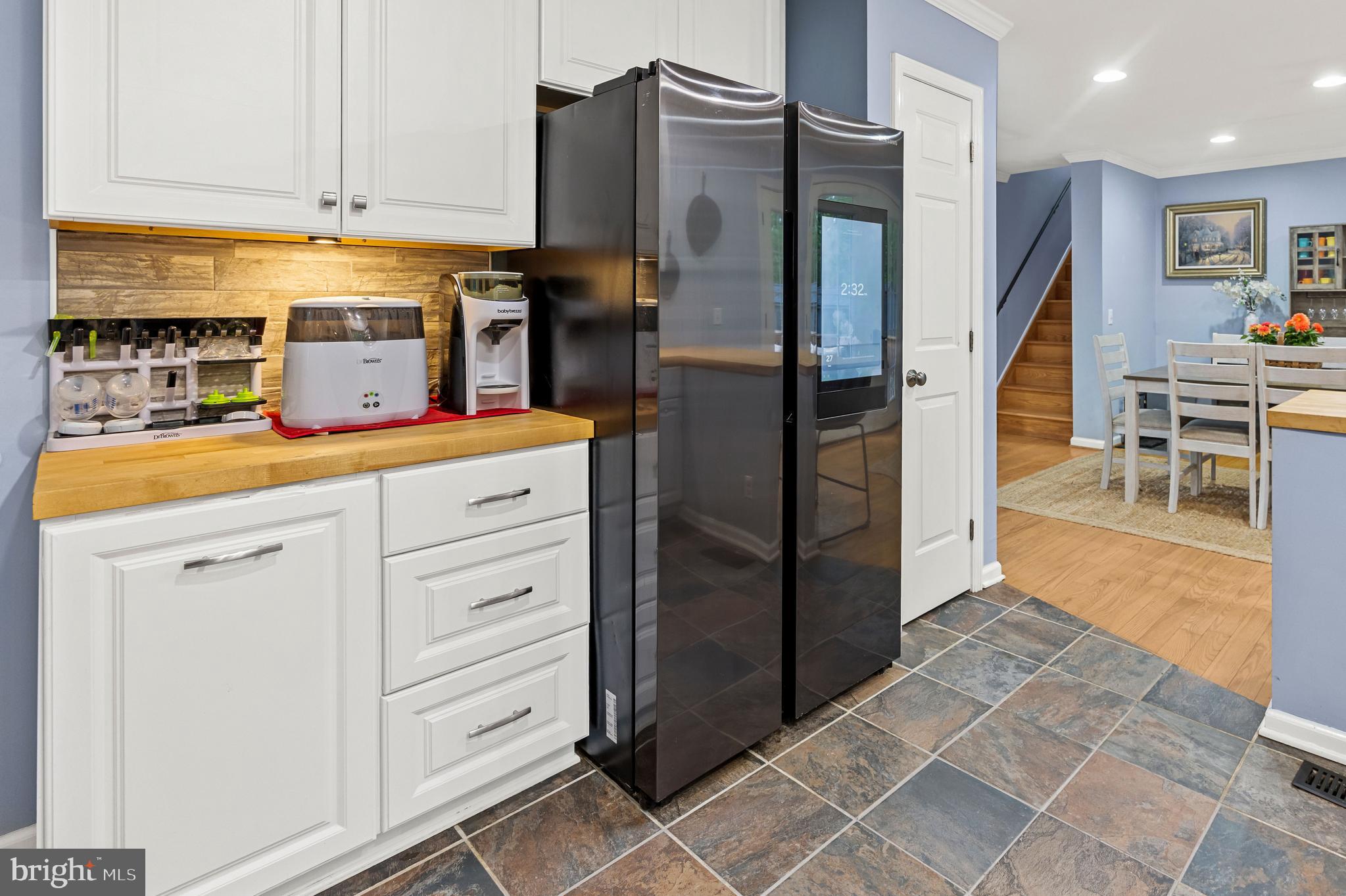 1425 Jacks Shop Road Rochelle, VA 22738 - Photo 19 of 56 a kitchen with stainless steel appliances kitchen island granite countertop a refrigerator and cabinets