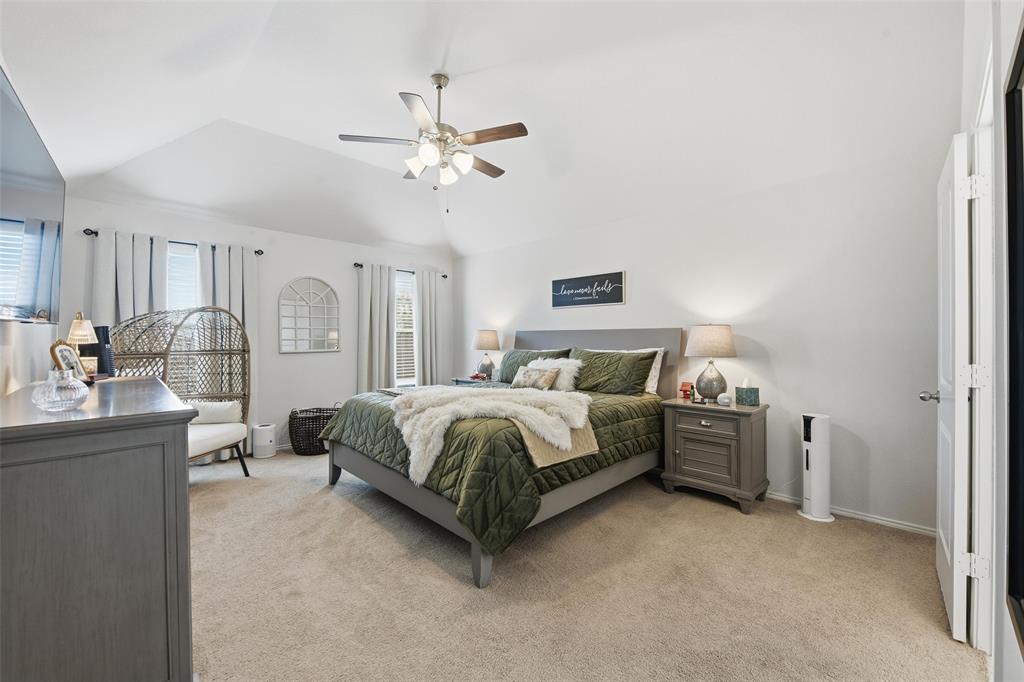725 Sandy Chip Trail Fort Worth, TX 76108 - Photo 18 of 30 a spacious bedroom with a bed a dresser and potted plant