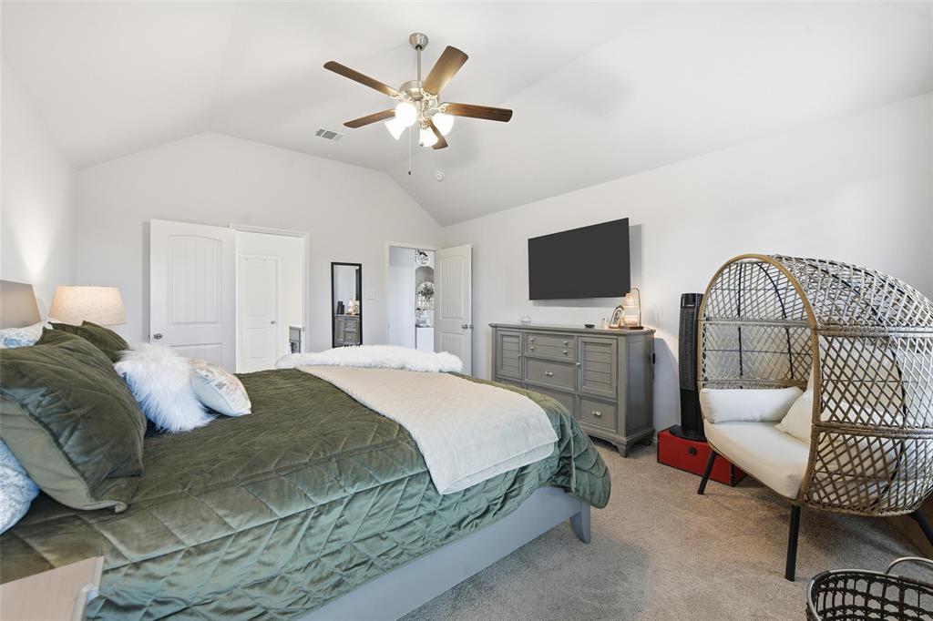 725 Sandy Chip Trail Fort Worth, TX 76108 - Photo 19 of 30 a bedroom with a bed and a flat screen tv