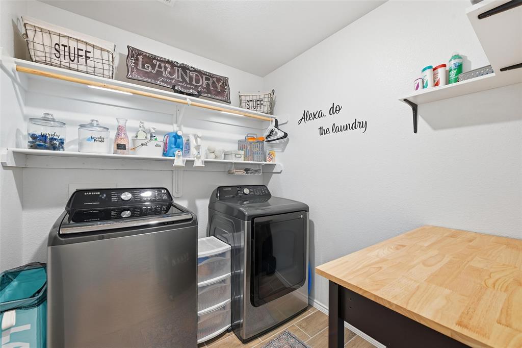 725 Sandy Chip Trail Fort Worth, TX 76108 - Photo 22 of 30 a kitchen with a stove and a refrigerator