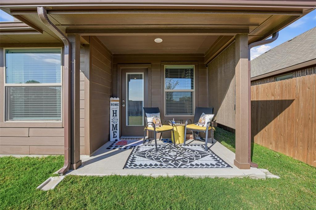 725 Sandy Chip Trail Fort Worth, TX 76108 - Photo 25 of 30 a chair and table in front of the house
