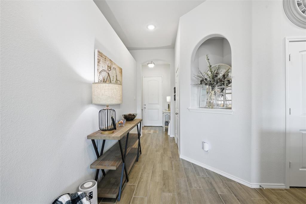 725 Sandy Chip Trail Fort Worth, TX 76108 - Photo 3 of 30 an entryway with wooden floor and windows