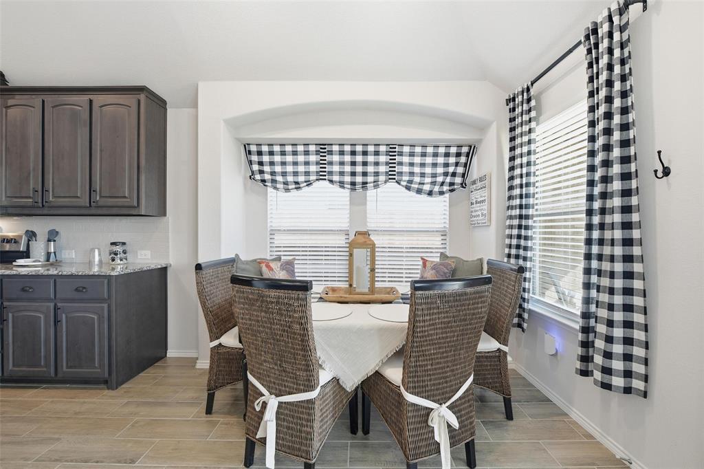 725 Sandy Chip Trail Fort Worth, TX 76108 - Photo 10 of 30 a view of a dining room with furniture window and wooden floor