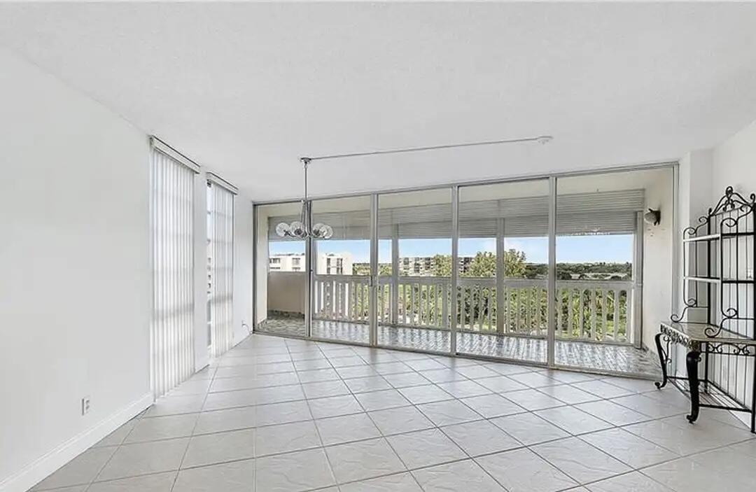 6921 Environ Boulevard, Unit 6S Lauderhill, FL 33319 - Photo 7 of 10 a view of a room with windows