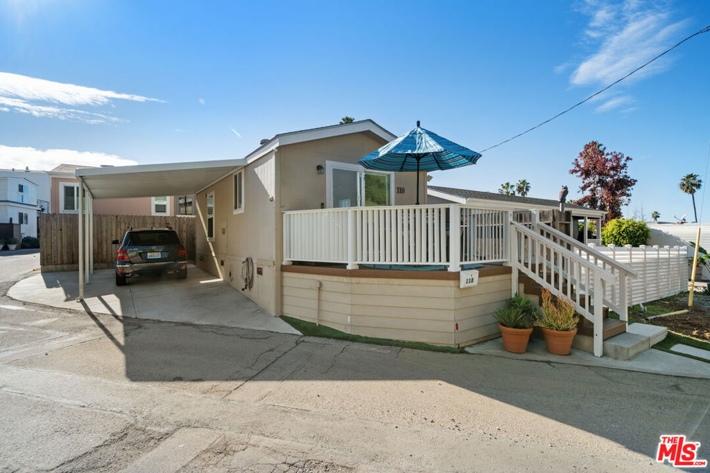 16321 Pacific Coast Highway, Unit 118 Pacific Palisades, CA 90272 - Photo 1 of 19 a view of a house with a yard
