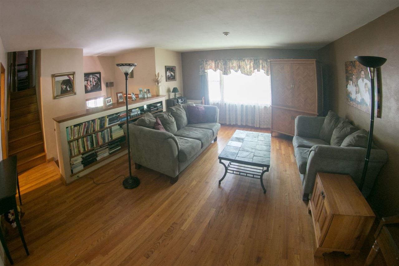 2703 North Alpine Road Rockford, IL 61114 - Photo 4 of 21 a living room with furniture and a wooden floor