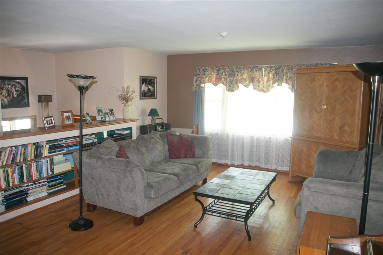 2703 North Alpine Road Rockford, IL 61114 - Photo 5 of 21 a living room with furniture and a window