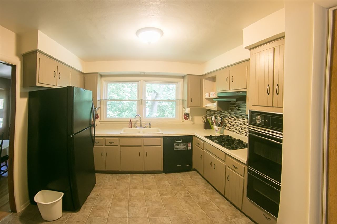 2703 North Alpine Road Rockford, IL 61114 - Photo 8 of 21 a kitchen with a stove a refrigerator and a sink