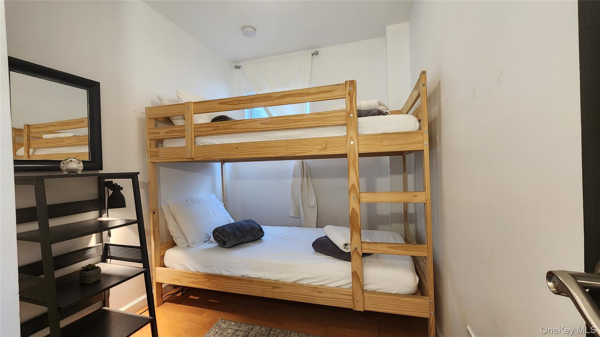 3437 State Rte 55 White Lake, NY 12786 - Photo 34 of 49 a bedroom with a bed and wooden floor