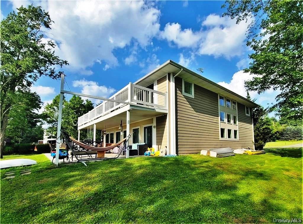 3437 State Rte 55 White Lake, NY 12786 - Photo 5 of 49 a front view of a house with a yard