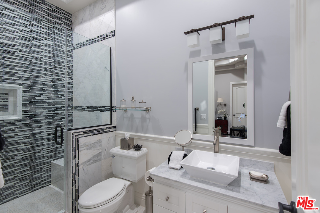15506 Meadowgate Road Encino, CA 91436 - Photo 38 of 50 a bathroom with a sink a toilet and shower