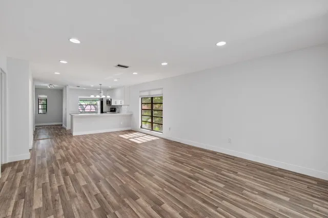 a kitchen with stainless steel appliances granite countertop a stove and cabinets