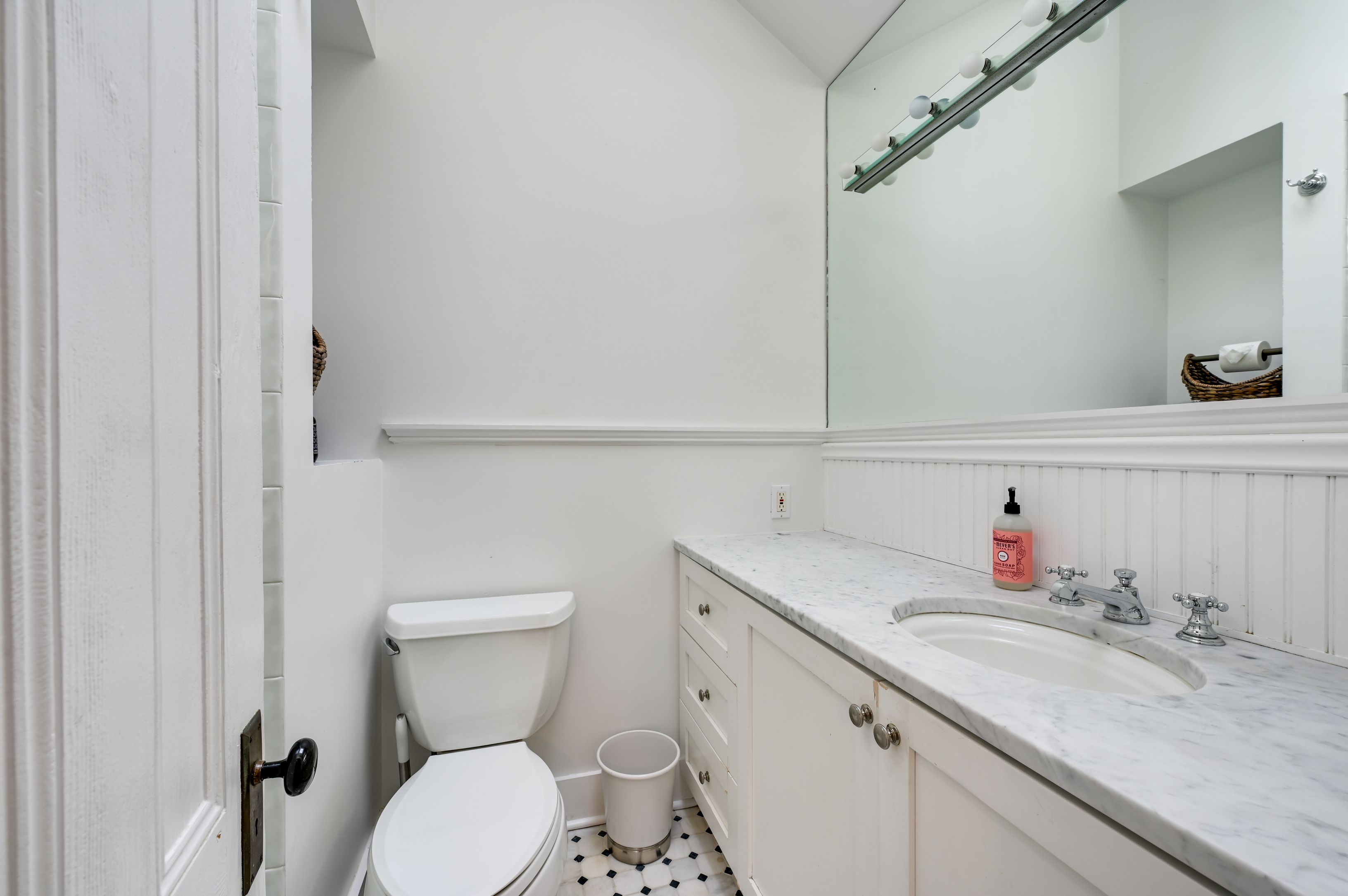Undisclosed Address Southampton, NY 11968 - Photo 13 of 19 a bathroom with a granite countertop toilet sink and mirror