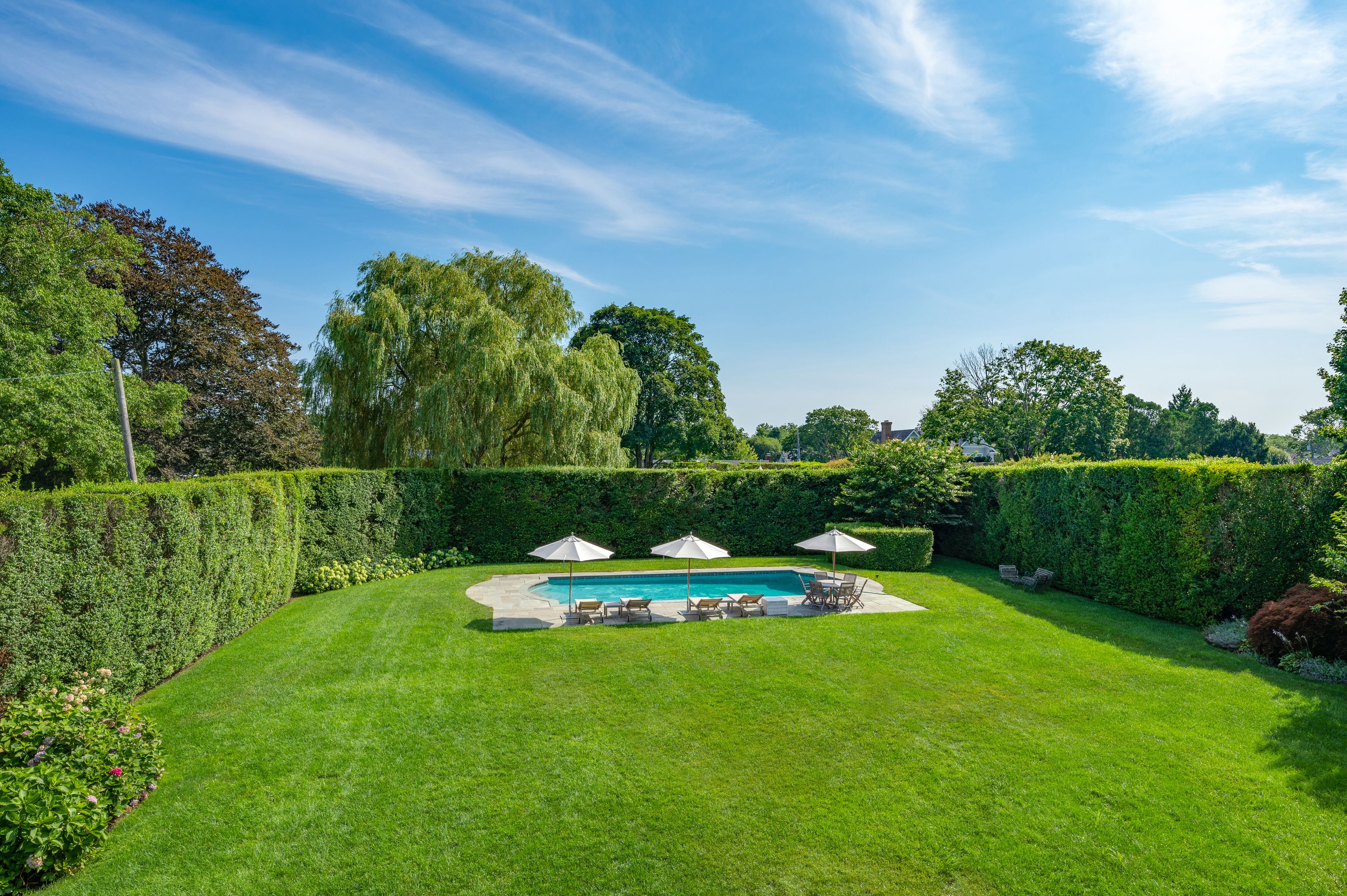 Undisclosed Address Southampton, NY 11968 - Photo 16 of 19 a view of a park with large trees