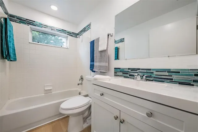 a bathroom with a sink a toilet and a bathtub