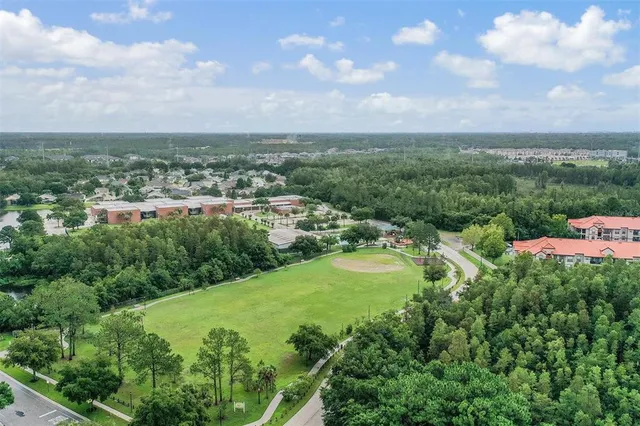 an aerial view of a golf course with a garden
