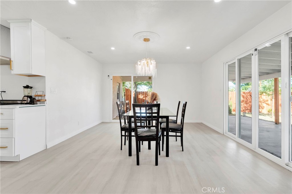 8263 3rd Avenue Hesperia, CA 92345 - Photo 17 of 56 a view of a dining room with furniture window and outside view