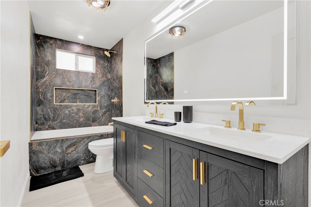 8263 3rd Avenue Hesperia, CA 92345 - Photo 18 of 56 a bathroom with a sink double vanity and a bathtub