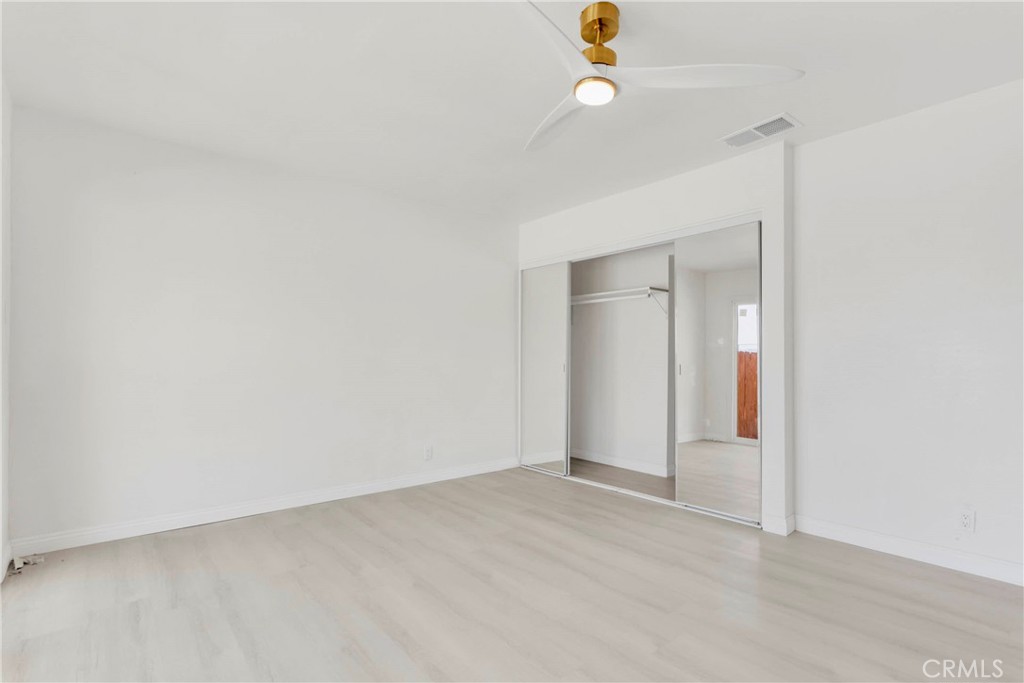 8263 3rd Avenue Hesperia, CA 92345 - Photo 20 of 56 an empty room with a empty space and a ceiling fan