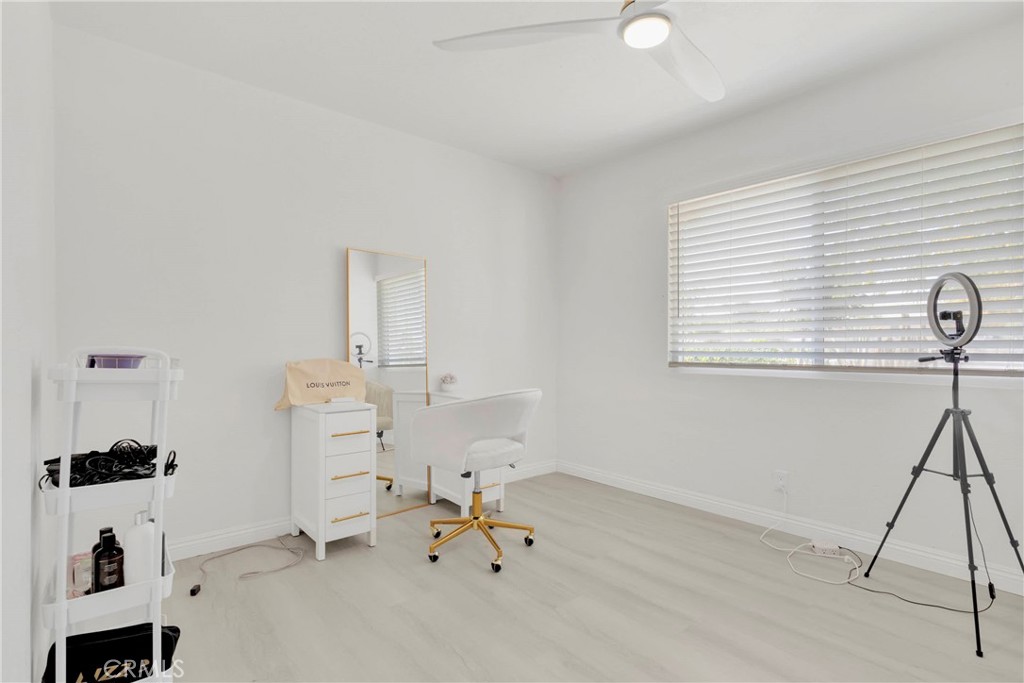 8263 3rd Avenue Hesperia, CA 92345 - Photo 23 of 56 a room that has a rug and a window