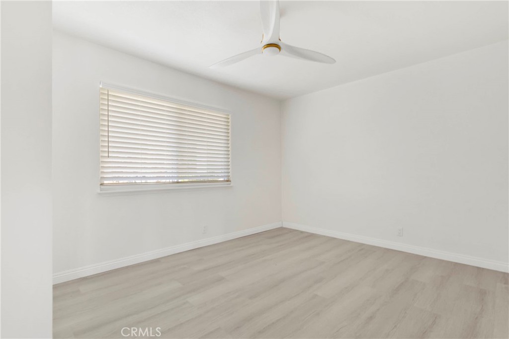 8263 3rd Avenue Hesperia, CA 92345 - Photo 25 of 56 an empty room with a window