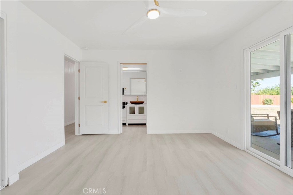 8263 3rd Avenue Hesperia, CA 92345 - Photo 27 of 56 a view of an empty room and window