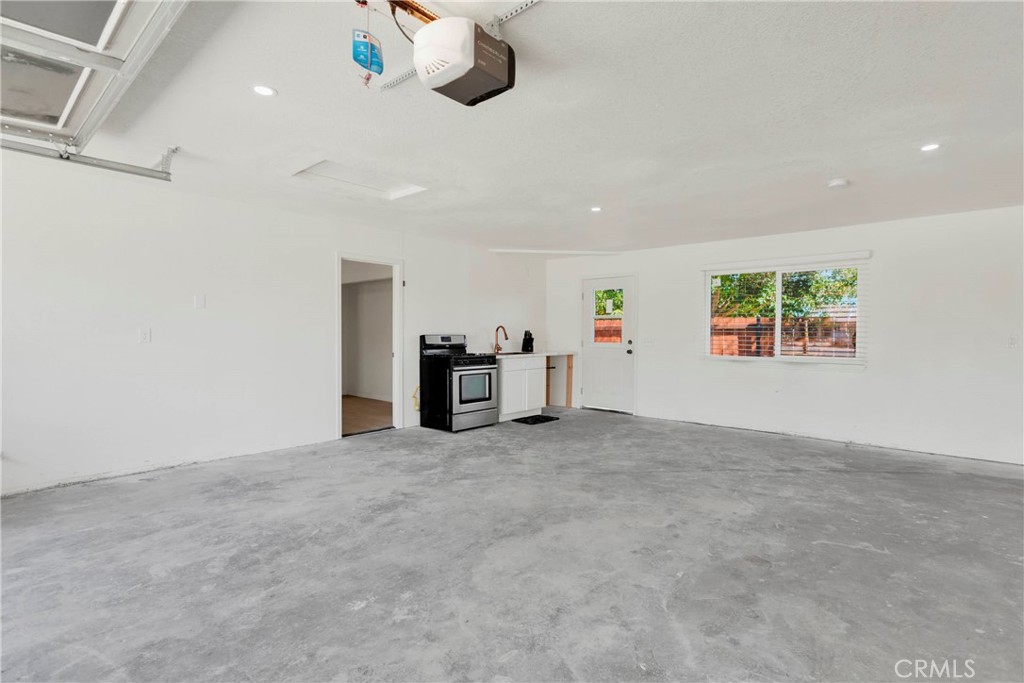 8263 3rd Avenue Hesperia, CA 92345 - Photo 30 of 56 an empty room with ceiling fan and window